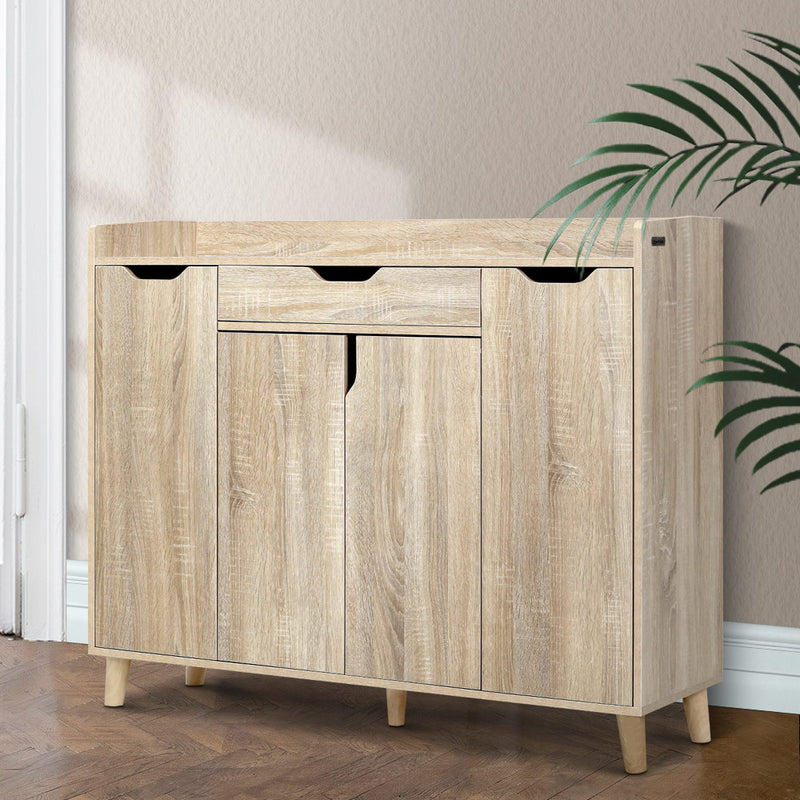 Alden 120cm shoe cabinet in pine with three enclosed storage compartments, adjustable shelves and a top drawer