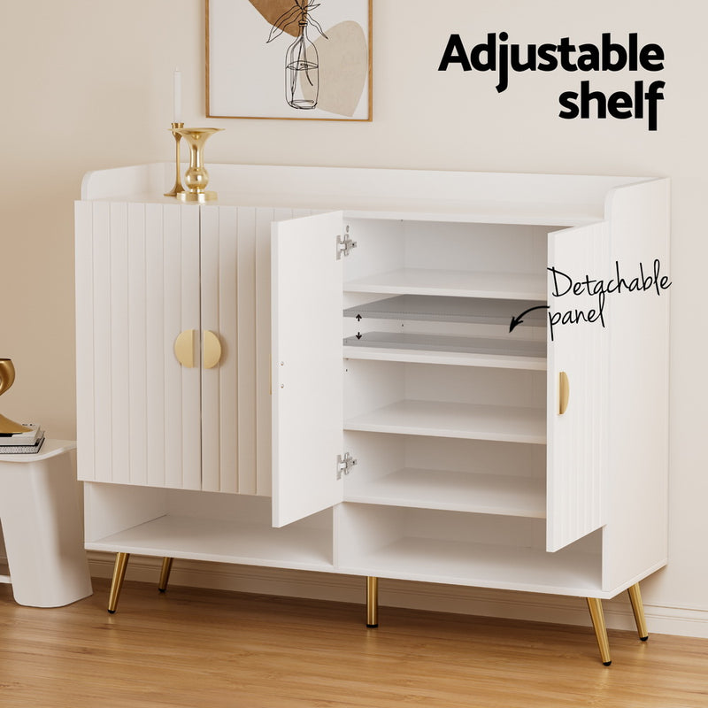 Aurelia white shoe cabinet with gold-finished metal legs, semicircular handles and adjustable shelves