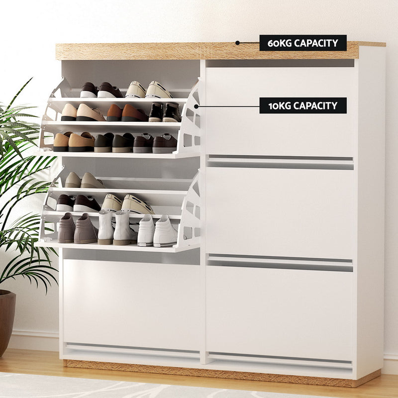 Nordwell shoe cabinet in white and pine with six flip-out drawers across three tiers and a recessed base